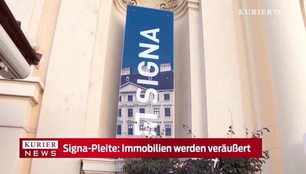 Ein Schild mit dem Schriftzug „Signa“ vor einem Gebäude.