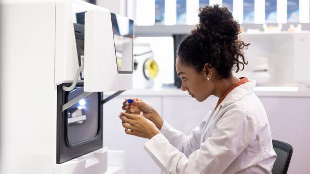 Health engineer bioprinting models at a 3D laboratory