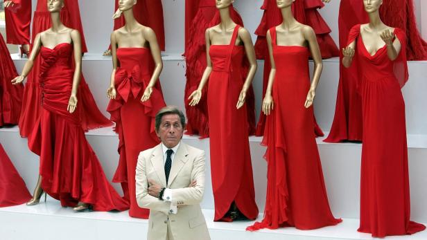 FILE PHOTO: Veteran Italian fashion designer Valentino Garavani poses during the opening of his exhibition at the Ara Pacis Museum in Rome