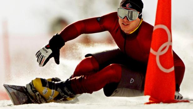FILE PHOTO: Ryan Wedding of Canada in Olympic snowboard parallel giant slalom practice in 2002