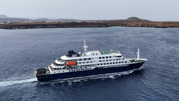 A drone view of the cruise ship MV Hondius, carrying passengers suspected of having cases of hantavirus on board, leaves Praia