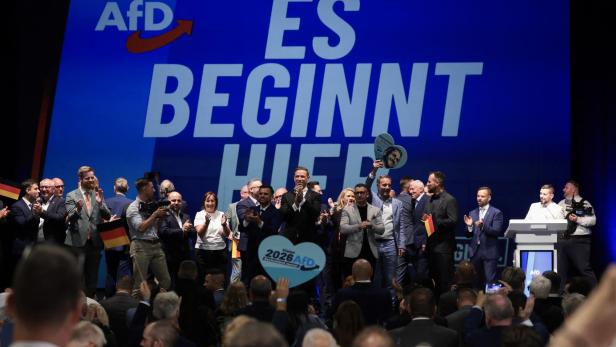 Members and supporters of the far-right Alternative for Germany (AfD) party react on after the announcement of the first exit poll results on public television at the AfD's election party following Saxony-Anhalt's state elections in Magdeburg, eastern Germany on September 6, 2026. Germany's far-right AfD won key regional elections on September 6 by a landslide with at least 44 percent of the vote in the eastern state of Saxony-Anhalt, said exit polls by two public broadcasters. 