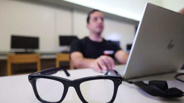 Morad, developer of the AI-powered Scribeme application, stands with a cane at the American University in Cairo (AUC) in Cairo