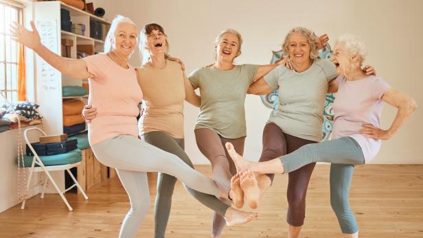 Friends, fitness and dance with a senior woman group having fun together in an exercise class. Gym, wellness and health with a mature female team training in a studio for an aerobic workout